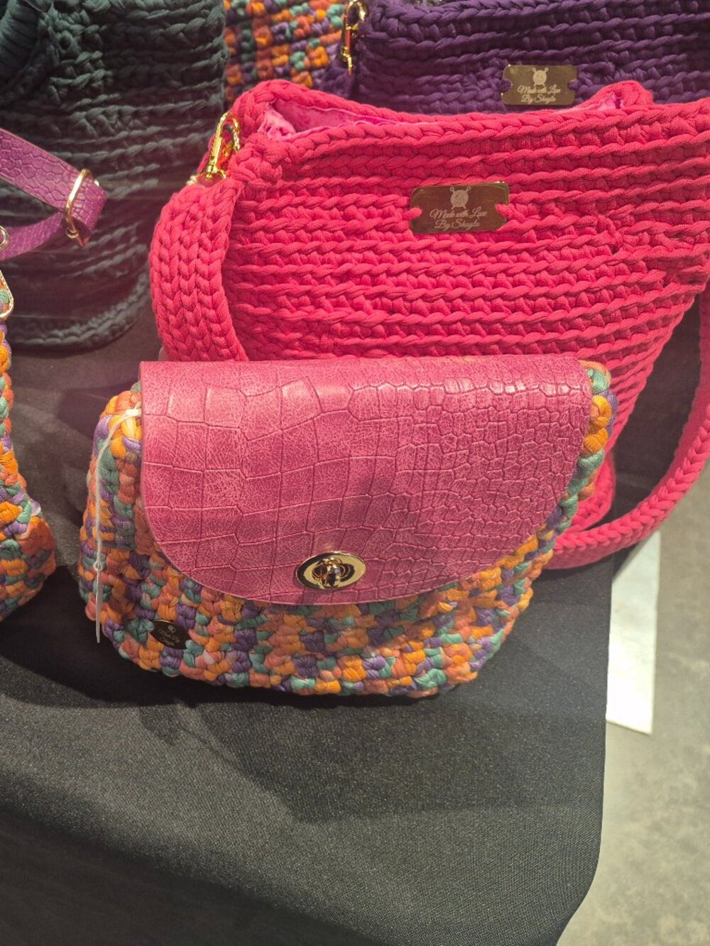 Beautiful handmade crocheted bags and a few designer bags and shopping bags